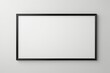 © haiqiang - blank picture frame on wall with white background