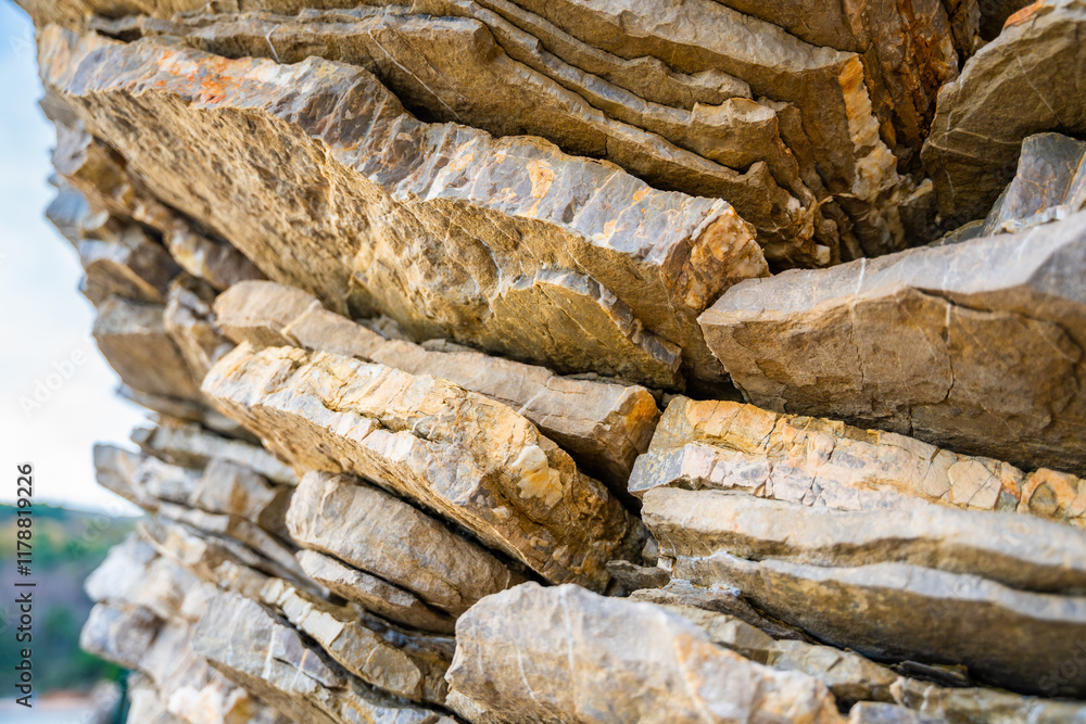 Layered rock texture in Budva, Montenegro. Sedimentary rocks with ...