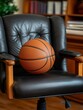 © Nadezhda Bolotina - Basketball resting on a black leather boss chair in a cozy indoor setting with wooden furniture