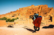 © Matteo Colombo - Man wearing costume rearing up a horse, Ait Benhaddou, Morocco