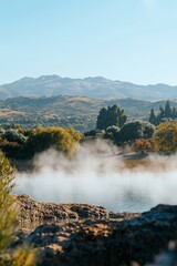 Poster - Serene Morning Mist Tranquil Geothermal Lake, Picturesque Rolling Hills of New Zealand