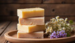 © Iryna - Handmade shampoo bars stacked on wooden tray with flowers, natural beauty