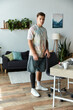 © Bliss - Young man embraces life with style and confidence in a modern living space