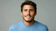 © Siasart - Portrait of a Smiling Man with Brown Hair and Blue Shirt against Gray Background