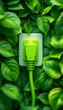 © Firman Dasmir - Green Energy Concept, Power Plug Surrounded by Lush Green Leaves for a Sustainable Future