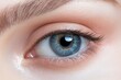 © ElenaElena - Human female eye of blue color close-up. Generated AI