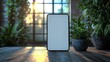 © Mark - A smartphone with an empty screen rests on a modern desk filled with indoor plants