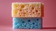 © Mark - Perfect for cleaning product promotions and kitchenware ads, a dishwashing sponge duo stands out on a vibrant blue background