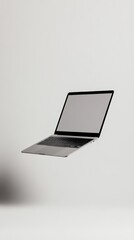 Wall Mural - modern, thin laptop with a blank screen levitating against a white background, ideal for displaying 
