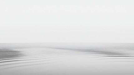 Poster - Gentle ripples are expanding on a calm water surface, creating a mesmerizing pattern against a clean white background, ideal for projects related to tranquility, purity, and minimalist aesthetics
