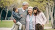 © gn8 - Multigenerational caucasian family enjoying a park outing during autumn