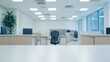 © trustmastertx - Blurred modern office interior with empty desk in foreground.