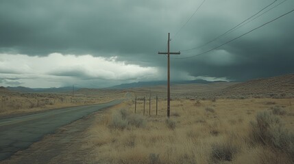 Wall Mural - Empty road stretches into a desolate landscape under a stormy sky.  A rusty utility pole stands sentinel amidst the dry, barren plains.