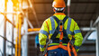 © kongkiat chairat - Construction worker in safety gear observing site operations