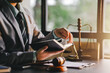 © Suphakant - Male consultant or lawyer working in the office legal concept Advice on justice and the law Male judge in courtroom