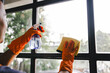 © Suphakant - people doing cleaning are using cloths and spraying disinfectant Wipe the glass in the office room. cleaning staff.cleaning maid