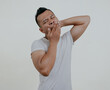 © PRIYO DWI SAPUTRO - Asian man yawning and scratching his head after wake up in the morning isolated on white background.