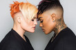 © AIPhoto - Stylish close up of two women with unique hairstyles, showcasing vibrant colors and intricate tattoos. Their expressions convey confidence and connection. Valentines Concept