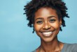 © iushakovsky - Portrait of a happy Afro-American woman with a warm smile