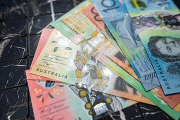 Wall Mural - Group of new AUD different denominations colorful australian money banknote dollar.