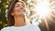 © vejaa - Portrait of smiling middle aged woman enjoying wonderful sunny day in nature. Weekend trip, vacation, active lifestyle
