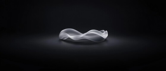 Wall Mural - a silver bracelet with a wave design is shown in a black background