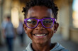 © Krystyna - Dark-skinned happy boy in purple glasses on a blurred background. Boy in optical glasses. Boys with poor eyesight in bright cheerful glasses.