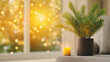 © Wasin Arsasoi - Cozy Home Sunset: A warm yellow candle glows softly beside a potted plant, set against the backdrop of a sun-drenched window with sparkling bokeh lights.