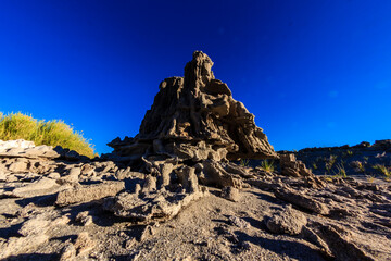 Wall Mural - A rocky hillside with a large rock in the middle