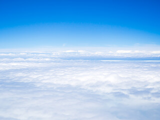 Wall Mural - Cloud sky above view airplane flight, blue horizon day landacapce clean heaven skyline, view window air fly aerial transportation travel tourist, nature change environment ecosystem freedom.