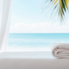 Relaxing beach scene with rolled towel on table, ocean view