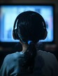 © Pascal - A student watching an educational YouTube video with headphones on.