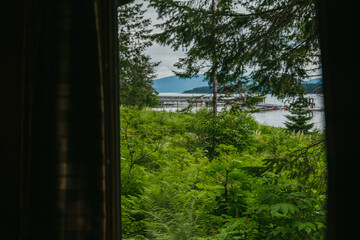 Canvas Print - View of dock at Bartlett Cove through forest in Glacier Bay Lodge in Glacier Bay National Park in southeast Alaska