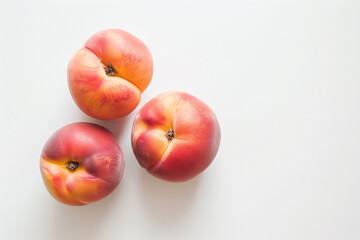 Wall Mural - Three peaches with a slight blush of color, set against a white backdrop.