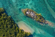 © AmazingAerialAgency - Aerial view of Middle Island with turquoise water, rocky shoreline, and lush vegetation, Ardyaloon, Australia.