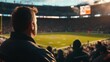 © jambulart - Man watches game, stadium crowd, sunset.