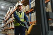 © Serhii - portrait of a smiling young warehouse worker working in a cash and carry wholesale store