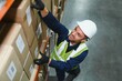 © Serhii - Young man working at a warehouse with boxes