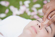 © fStop - Close up of a woman receiving a  facial massage outdoor