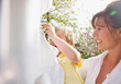 © fStop - Young boy helping mother hanging linens on a clothesline