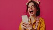 © Akmalism - Excited happy woman looking at phone screen, celebrating online win, overjoyed young female screaming with joy, holding smartphone, reading good news in unexpected message or email.