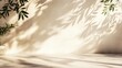 © Akmalism Photography - Minimalistic light background with blurred foliage shadow on a beige wall. Beautiful background for presentation with marble floor.