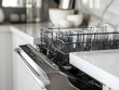 © Praphat - Modern Kitchen Dishwasher with Clean Glassware on Open Door