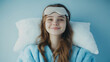 © Julia Zarubina - smiling young european woman in pajamas, with sleep mask on head on white background