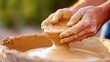 © Design Depot - Mastering the art of pottery through skilled hands shaping clay on a wheel