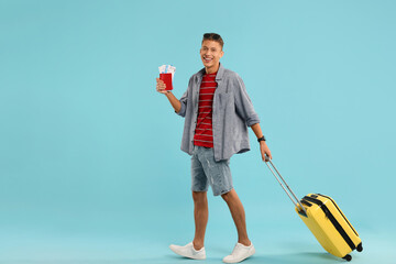 Sticker - Happy traveller with suitcase, passport and tickets on light blue background