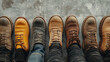 © PickaPic - A clean shot of multiple pairs of work boots lined up, each pair telling a story of labor, on a plain concrete floor.