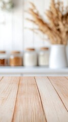 Poster - Empty wooden table with a blurred kitchen background featuring jars of ingredients and dried flowers, creating an inviting space for showcasing products