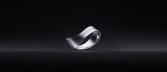 Poster - a silver ring with a wavy design sits on a black surface