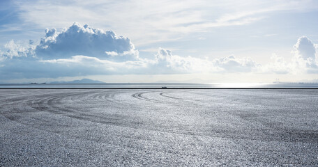 Wall Mural - asphalt road square and beautiful coastline with sky clouds nature landscape. outdoor asphalt parkin